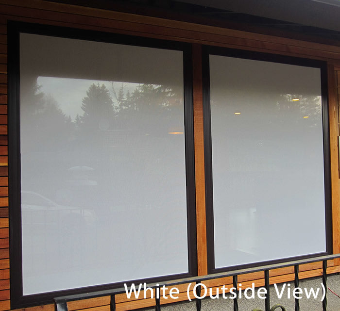 CollidEscape Window Protector, White, shown on a window, offers privacy and reduces bird strikes with a perforated pattern allowing sunlight in.