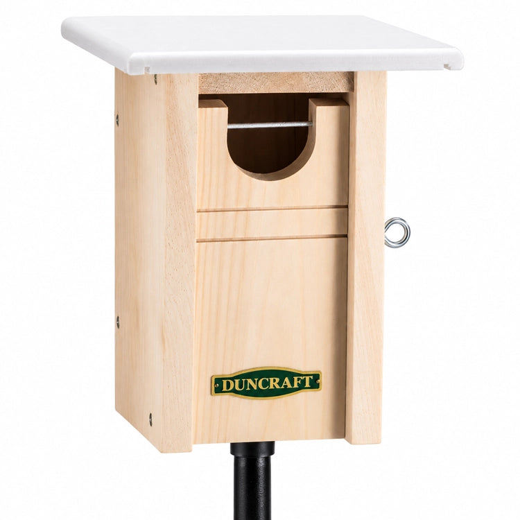 Duncraft Bluebird Trail House & Pole showing a wooden birdhouse with a white top, oval entry hole, and double-layer roof for insulation.