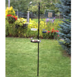 Premium Feeding Station with birds perched on it, featuring a mesh tray and water dish, designed to attract birds with adjustable and stationary arms.