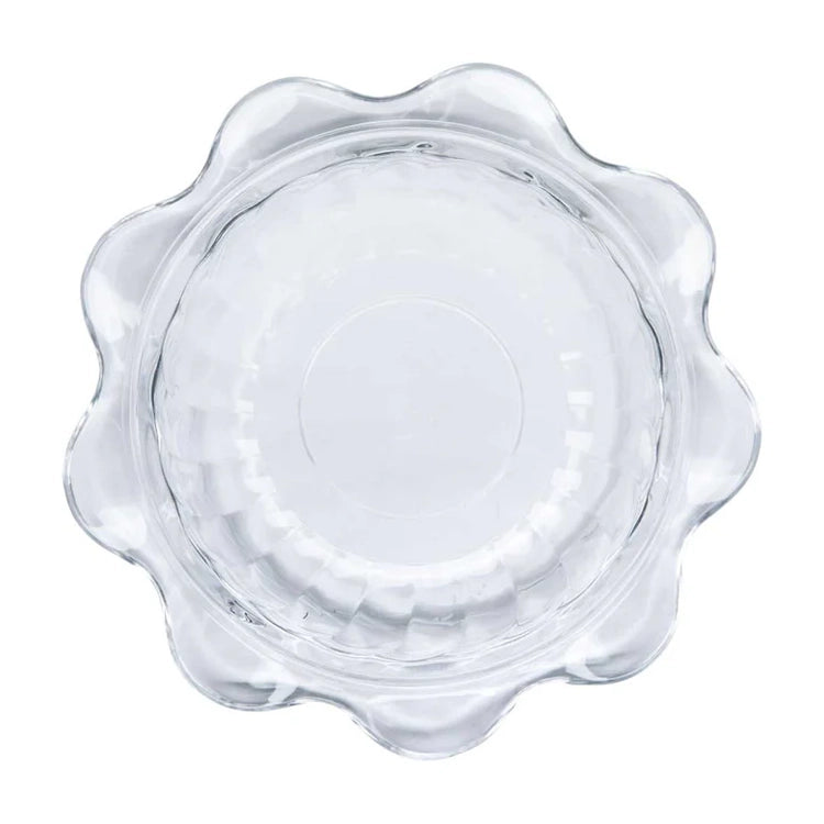 Clear glass plate with wavy edge on a white background