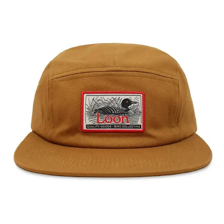 Loon Lake Camp Hat featuring a loon patch on a tan canvas, crafted from corduroy with an adjustable metal clasp strap. Perfect for bird enthusiasts.