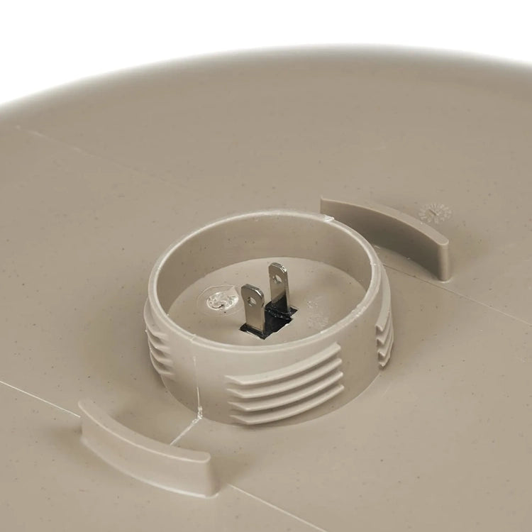 Underside view of All Seasons Heated Bird Bath, Deck Mount, showing twist-lock tabs and metal prongs for easy electrical connection to maintain bird water in freezing temperatures.