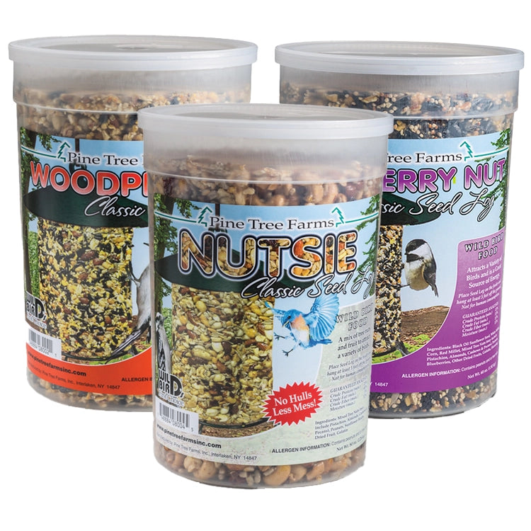 Jumbo Classic Seed Logs, Set of 3, featuring Nutsie, Woodpecker, and Berry Nut seed mixes in clear tubs, ideal for attracting diverse backyard birds.