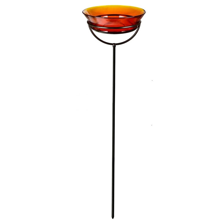 Cuban Garden Stake: black metal stake with amber-orange glass bowl, adjustable height, eco-friendly, used as birdbath or suncatcher.