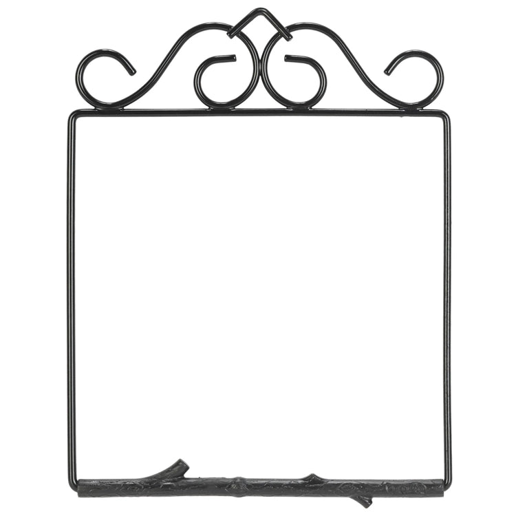 Decorative black metal picture frame with intricate designs on a white background