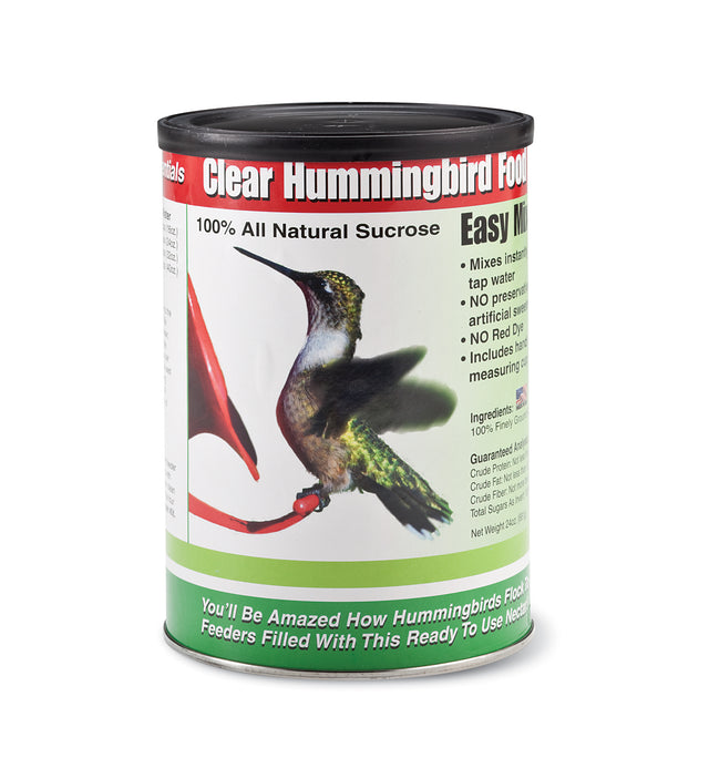 Clear Hummingbird Food in a 24 oz. resealable canister with a bird graphic. Includes measuring scoop and instructions for easy nectar preparation.