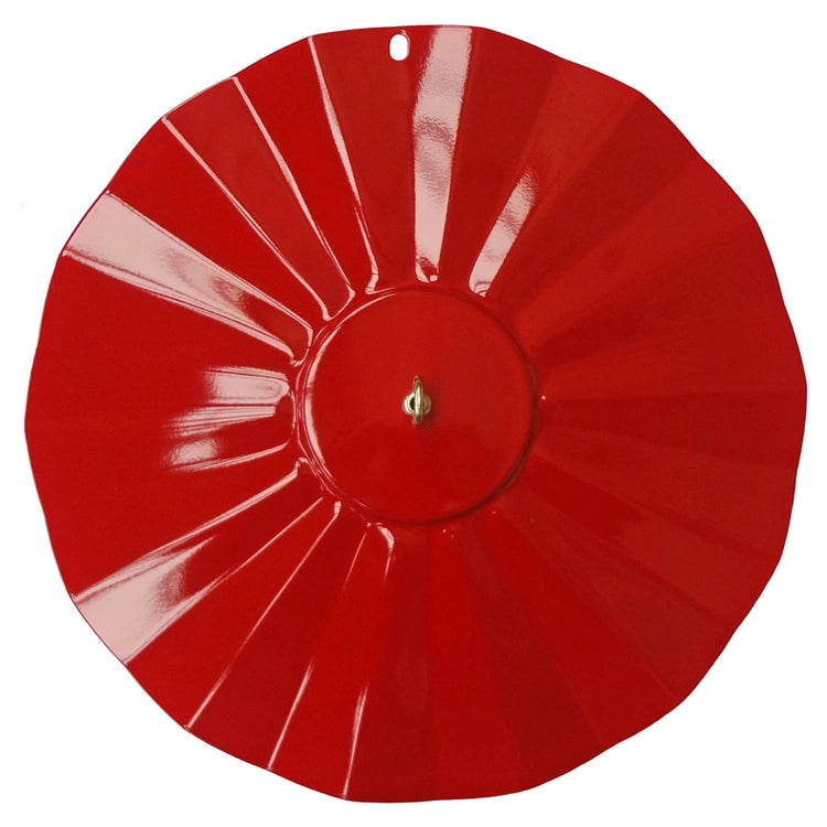 Red decorative plate with a central design on a white background