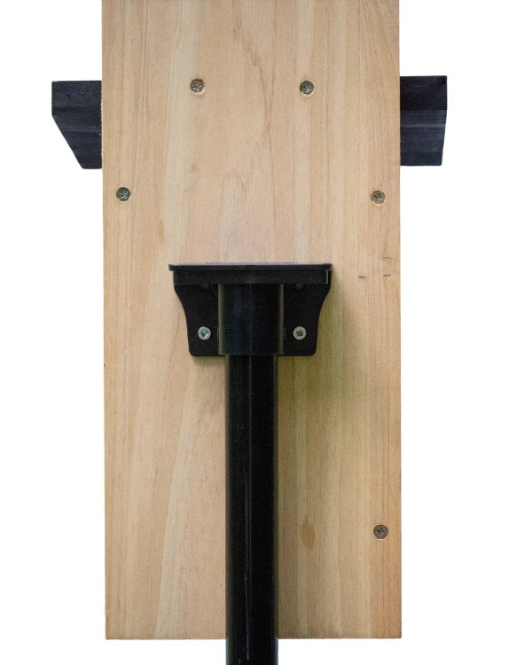 Brome BirdsUP Mounting Flange shown with a black pole on a wooden board, designed for 1-inch poles, includes four stainless screws for secure mounting.