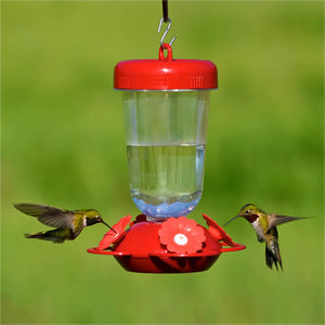 Perky's Finest Plastic Top Fill Feeder with 4 feeding stations, showing hummingbirds drinking from its lifelike red and white ports.