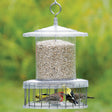 All Weather Feeder with Wire Cage, showing birds feeding from a weatherproof, squirrel-proof feeder with protected seed ports and a circular baffle for easy bird access.