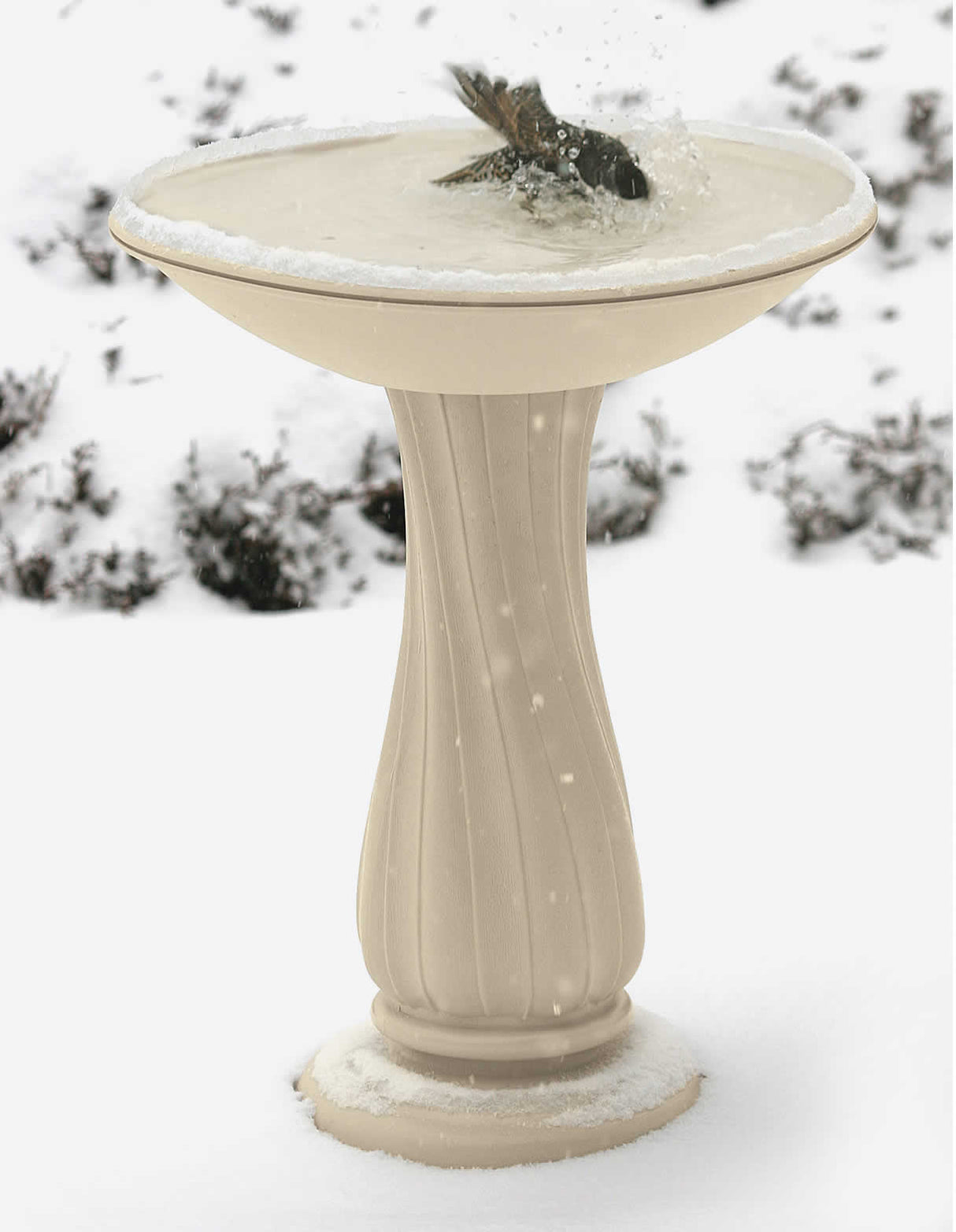 All-Seasons Heated Bath with 25 Pedestal featuring a bird in the bath surrounded by snow, showcasing its durability and functionality in winter conditions.