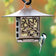 Nuthatch Suet Feeder: Bird on a weather-resistant aluminum feeder with a copper finish, featuring a nuthatch design, for adding yard decoration and feeding wildlife.
