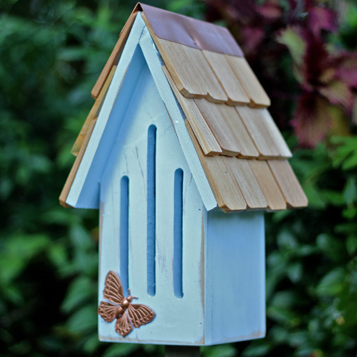 Butterfly Breeze House, with a copper butterfly on the roof, features a blue birdhouse design and includes a 30-inch mounting stake.