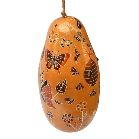 Day Pollinators Gourd Birdhouse featuring butterflies, bees, and flower designs, with a 1-1/4 inch opening for small birds. Hand-carved and ready to hang.