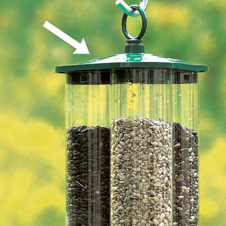 Duncraft's Green Triple Tube Top bird feeder with seeds, featuring a triangular top and locking loop with spring-loaded locking action.