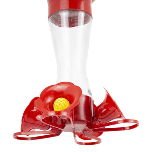 Close-up of the #1 Best Four Flower Frolic hummingbird feeder, featuring clear glass, red plastic parts, and four yellow bee guards with flower feeding ports.