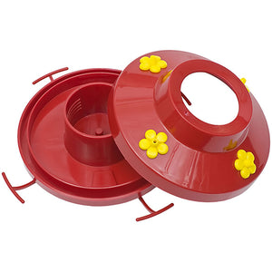 Pinch Waist Hummer Feeder with red plastic cap, yellow feeding ports, open lid, and clear glass vase featuring a decorative pinch waist design.