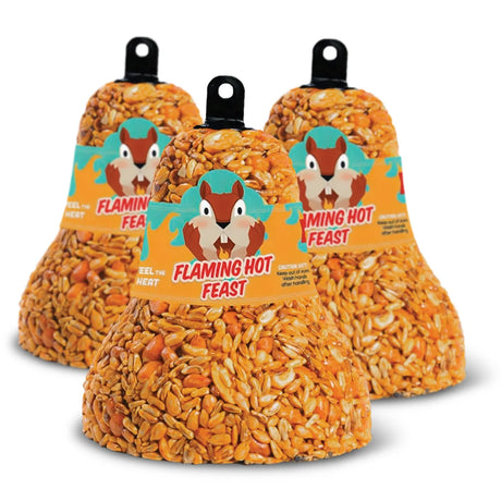 Flaming Hot Feast Bell, Set of 3: Three bell-shaped suet blocks with seeds, hanging loops, and a cartoon squirrel band, designed to attract birds and deter squirrels.