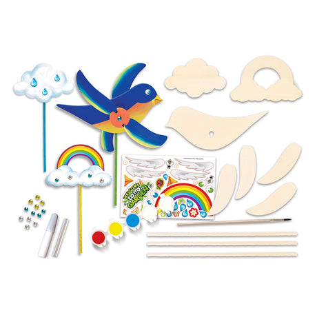 Whirligig Buildable Wood Paint Kit for kids, featuring an unassembled bluebird whirligig and two garden stakes, ideal for creative crafting.