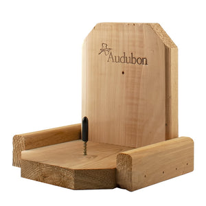 Squirrel Platform Feeder: A sturdy cedar wooden box with an attached rod for mounting corn, designed to feed and distract squirrels from bird feeders.