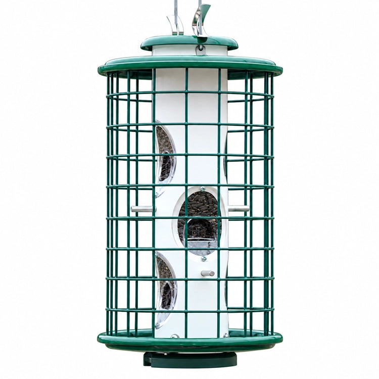 Green squirrel-resistant caged bird feeder with white seed tube, multiple feeding ports, and protective metal cage on a white background.