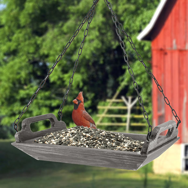 Rustic Farmhouse Barn Trough Platform Feeder with bird, featuring metal mesh bottom and a wooden structure, holds 1.5 lbs of seeds.