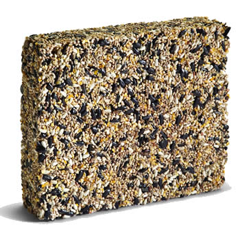 Close-up of a Duncraft Premium Cake bird seed mix with sunflower hearts, millet, canary seed, cracked corn, and safflower seeds for feeding various bird species.