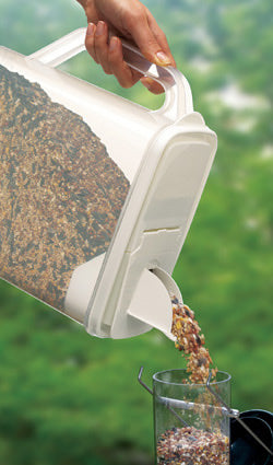 Seed Storage Container with Dual-Pour™ spout, held by a person, designed for filling various feeders, holds up to 10 lbs of birdseed or pet food.