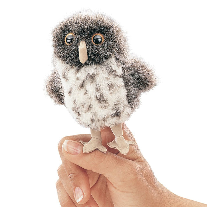 Hand holding a Folkmanis Mini Owl Finger Puppet, showcasing the detailed, huggable owl design ideal for imaginative play and adventures.