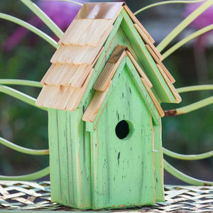 Green birdhouse with a shingled roof, copper peak, and front opening for easy cleaning; features a 1-1/2 inch entry hole, ideal for attracting bluebirds.