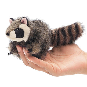 Hand holding Folkmanis Mini Critter Finger Puppet, resembling a raccoon, showcasing its lifelike details and clever paws for interactive play.