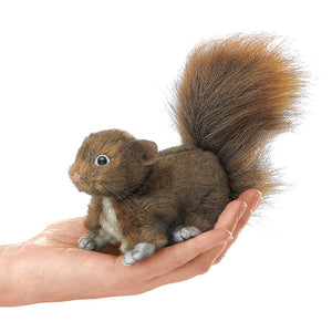 Hand holding a Folkmanis Mini Critter Finger Puppet, resembling a lifelike squirrel with detailed features, perfect for imaginative play.