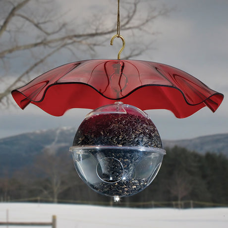 Red Swirl Weather Guard - A bird feeder with a protective red umbrella to shield from rain and snow, featuring scalloped edges and a hook for hanging.