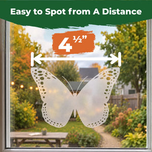 Translucent 4.5-inch butterfly window decal applied to glass with a backyard visible outside.