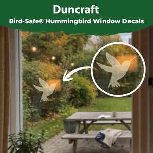 Duncraft Bird-Safe hummingbird window decal displayed on a window with a close-up showing its translucent design.