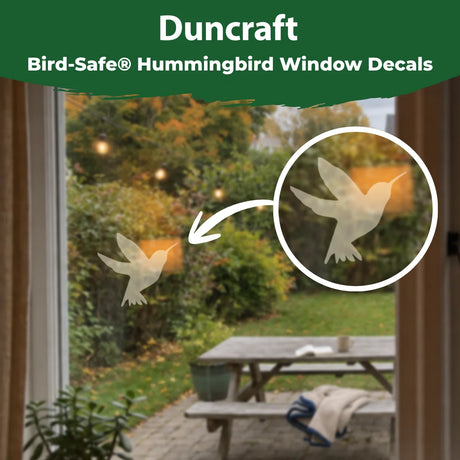 Duncraft Bird-Safe hummingbird window decal displayed on a window with a close-up showing its translucent design.