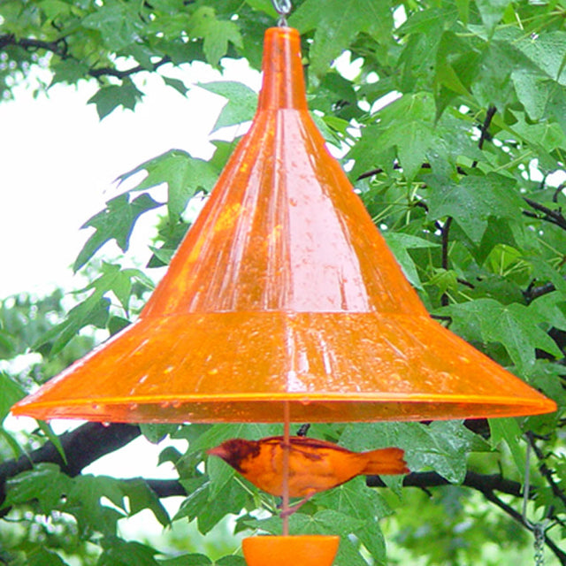 Arundale Hanging Orange Oriole Hat in a bird feeder, designed to protect oriole food and provide shaded feeding space, with an attached 24-inch hanging chain.