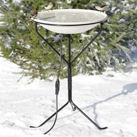 Heated Bird Bath with Metal Stand, shown in snow with birds drinking and bathing. Features a 20-inch diameter basin, non-slip surface, and built-in thermostat for winter use.