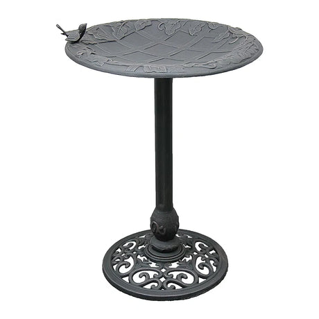 English Ivy Birdbath, Copper Rust: Cast-iron birdbath with leaf-patterned basin, bird accent, slender stem, and scroll-work base, offering elegance and stability for garden birds.