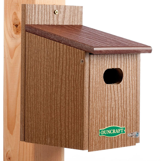 Duncraft Eco-Strong Swallow House: a wooden birdhouse on a post with an oval entrance hole, designed to attract swallows and bluebirds while deterring House Sparrows.