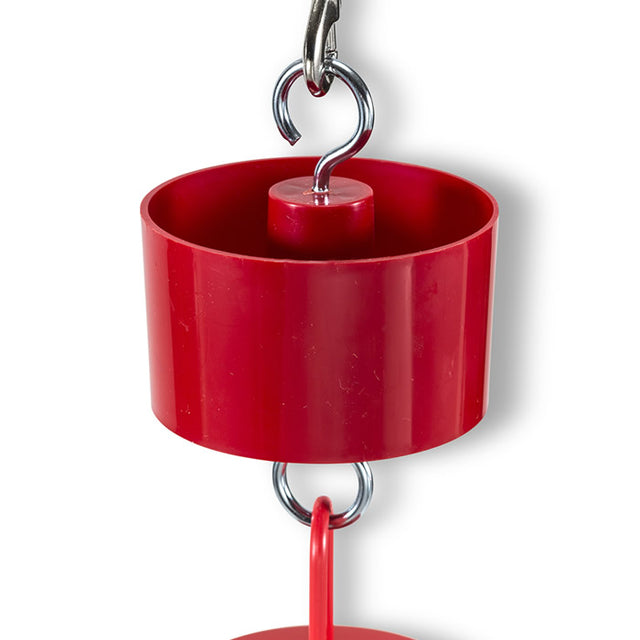 Red Ant Moat Baffle with a hook and metal handle, designed to keep ants away from hummingbird feeders by filling it with water.