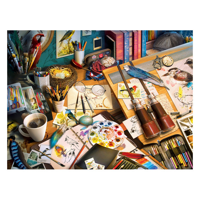 Audubon Creative Birding 300 pc. EzGrip Puzzle depicting a desk with art supplies, bird, and nest, perfect for bird lovers and artists.