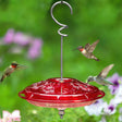 Aspects HummZinger Fancy hummingbird feeder with wraparound perch and four feeding stations. Features red plastic cover, clear basin, and built-in ant moat.