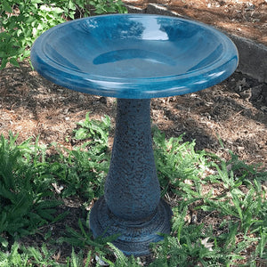 Navy Blue Fiber Clay Bird Bath in a garden setting, featuring a large, sloping basin for birds to splash and preen.