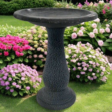 Cool Grey Fiber Clay Bird Bath in a garden, featuring a full-sized basin for bird watching, lightweight design, and a sturdy, matte finish pedestal.