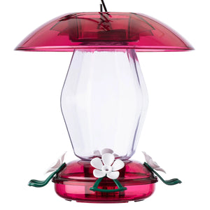 Jubilee Hummingbird Feeder with white flower-shaped feeding ports, clear plastic reservoir, red weather guard, S-hook, ant moat, and green perches. 20 oz. capacity, 4 feeding ports.