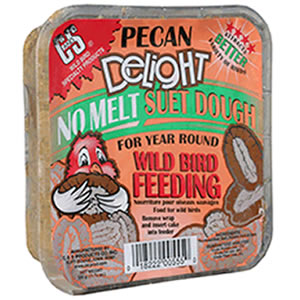 Plastic container of Pecan Delight Suet Cakes, a bird food blend with beef suet, pecans, corn, and oats, ideal for attracting various bird species. Sold in cases of 12.