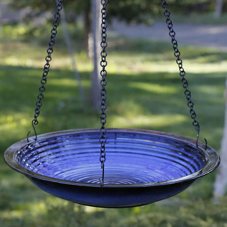 Hanging Circles Bird Bath, Cobalt Blue, featuring a stoneware basin with concentric circles, suspended by a 34-inch chain and S-hook for outdoor use.