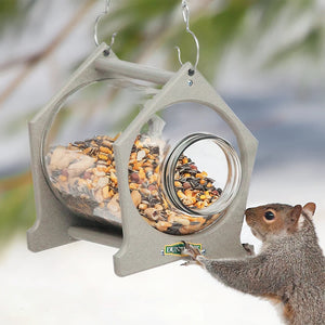 Duncraft Hanging Squirrel Jar Feeder with a wide mouth jar, offering squirrels easy access to treats, diverting them from bird feeders. Durable recycled plastic construction.