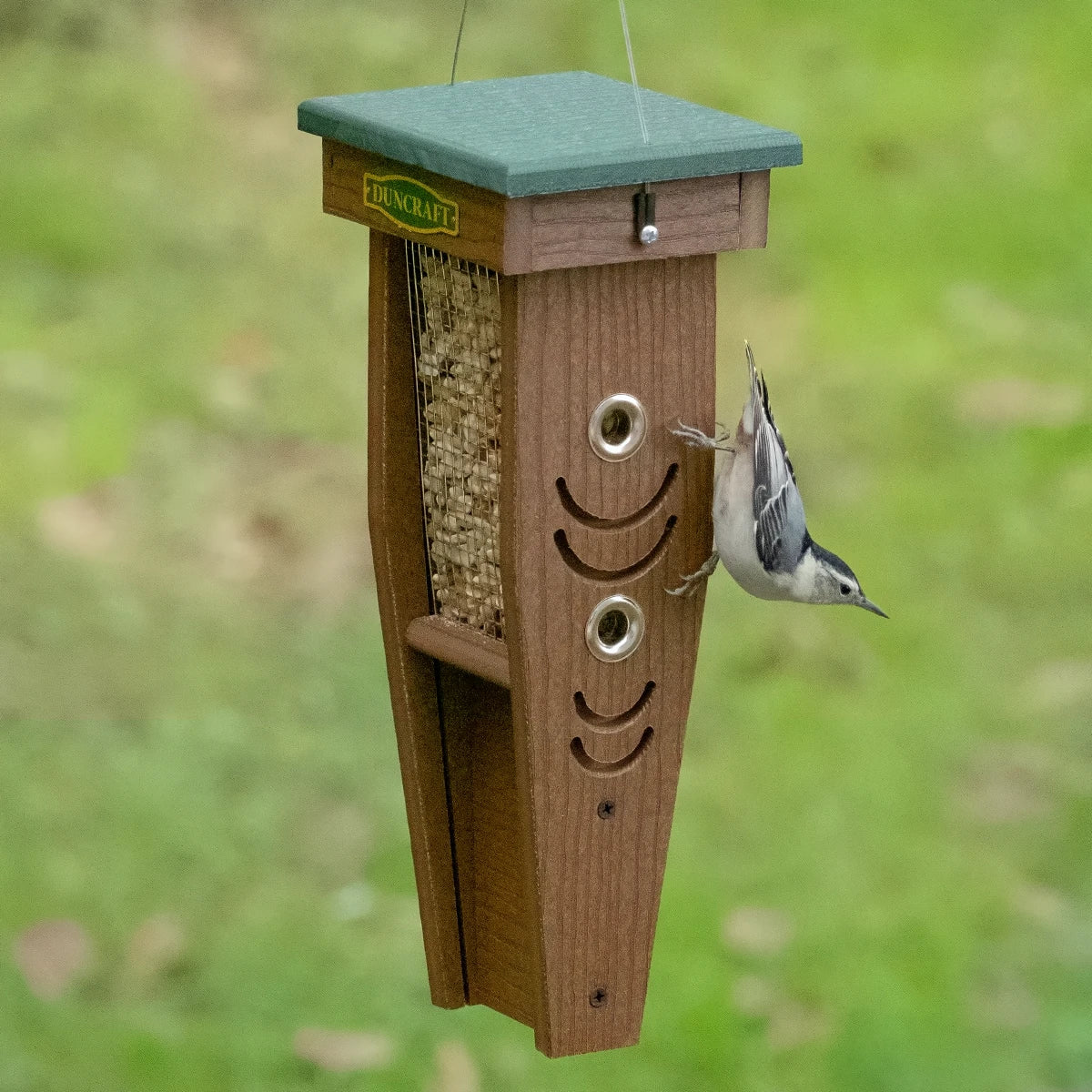 Duncraft Woodpecker Mesh Feeder with grooved perches and mesh sides, featuring four feeding ports and a cable hanger for easy viewing and refilling.